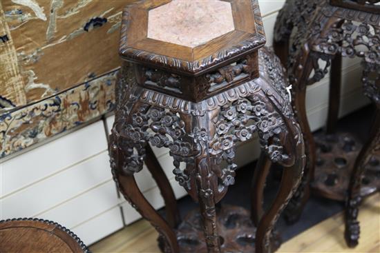 A pair of Chinese hongmu and rouge marble inset hexagonal stands, late 19th century, H.78cm